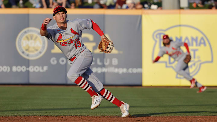 Mar 14, 2025; Port St. Lucie, Florida, USA; St. Louis Cardinals second baseman Michael Helman (13) chases a ball during the second inning against the New York Mets at Clover Park. Mandatory Credit: Reinhold Matay-Imagn Images Mar 14, 2025; Port St. Lucie, Florida, USA; St. Louis Cardinals second baseman Michael Helman (13) chases a ball during the second inning against the New York Mets at Clover Park. Mandatory Credit: Reinhold Matay-Imagn Images