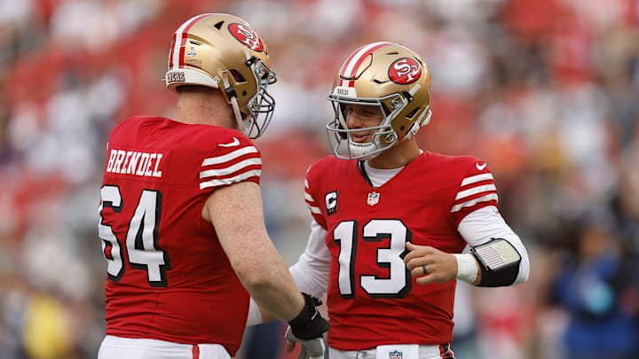 San Francisco 49ers quarterback Brock Purdy (R) and center Jake Brendel (L)