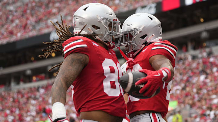 Aug 31, 2024; Columbus, OH, USA; Ohio State Buckeyes running back James Peoples (20) celebrates a touchdown with tight end Gee Scott Jr. (88) during the second half of the NCAA football game against the Akron Zips at Ohio Stadium. Ohio State won 52-6. Aug 31, 2024; Columbus, OH, USA; Ohio State Buckeyes running back James Peoples (20) celebrates a touchdown with tight end Gee Scott Jr. (88) during the second half of the NCAA football game against the Akron Zips at Ohio Stadium. Ohio State won 52-6.