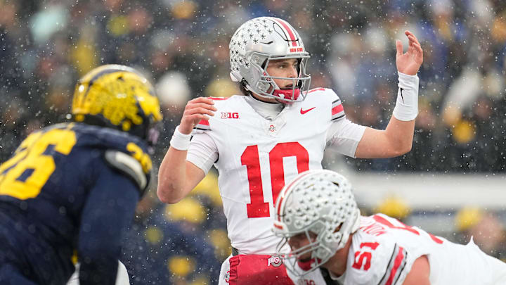 Ohio State Buckeyes quarterback Julian Sayin (10) lines up during the NCAA football game against the Michigan Wolverines at Michigan Stadium in Ann Arbor, Mich. on Nov. 29, 2025. Ohio State won 27-9. Ohio State Buckeyes quarterback Julian Sayin (10) lines up during the NCAA football game against the Michigan Wolverines at Michigan Stadium in Ann Arbor, Mich. on Nov. 29, 2025. Ohio State won 27-9.