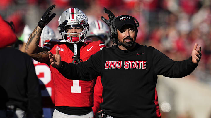 Ohio State Buckeyes head coach Ryan Day and wide receiver Brandon Inniss (1) react during the second half of the NCAA football game against the Rutgers Scarlet Knights at Ohio Stadium in Columbus on Nov. 22, 2025. Ohio State won 42-9.