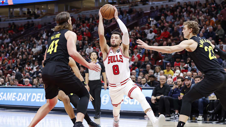 Chicago Bulls guard Zach LaVine (8) drives to the basket against Utah Jazz forward Kelly Olynyk (41) during the second half at United Center. Mandatory Credit: Kamil Krzaczynski-Imagn Images
