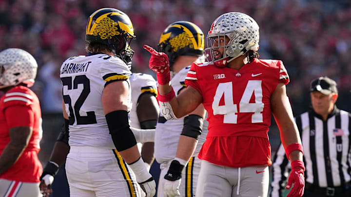 Ohio State Buckeyes defensive end J.T. Tuimoloau points out a false start against Michigan. 