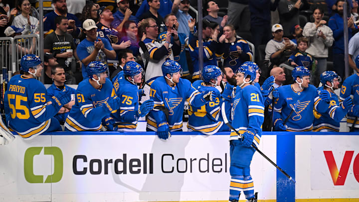  Apr 14, 2026; St. Louis, Missouri, USA; St. Louis Blues right wing Jimmy Snuggerud (21) celebrates with teammates after scoring a goal against the Pittsburgh Penguins during the first period at Enterprise Center. Mandatory Credit: Connor Hamilton-Imagn Images