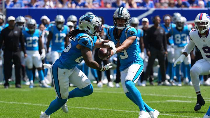 Carolina Panthers quarterback Bryce Young (9) hands the ball off to Carolina Panthers running back Jonathon Brooks Carolina Panthers quarterback Bryce Young (9) hands the ball off to Carolina Panthers running back Jonathon Brooks