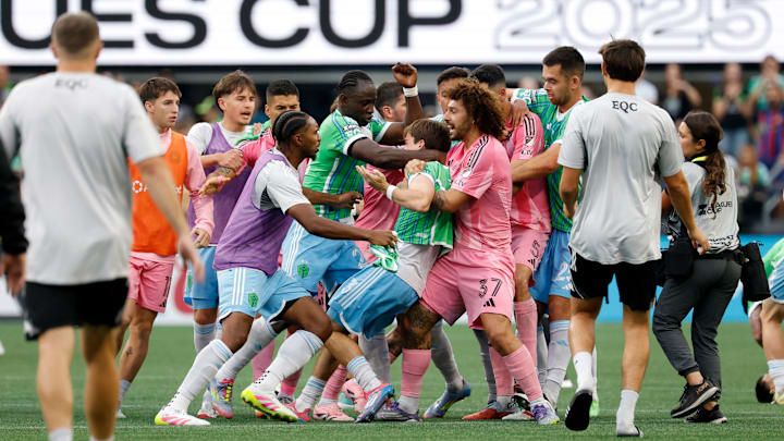 Inter Miami CF center back Maxi Falcon, 37, holds Seattle Sounders midfielder Obed Vargas while Sounders players try to free their teammate during a brawl started by Miami's Luis Suarez after Sunday's Leagues Cup final, a 3-0 Seattle victory.