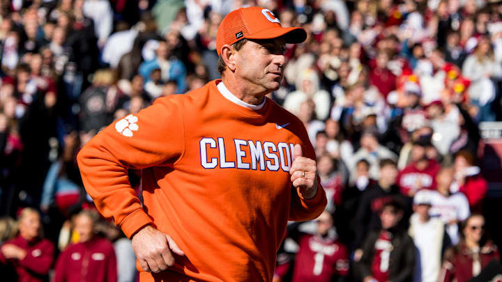 Clemson Tigers head coach Dabo Swinney leads his team on the field before the game against the South Carolina Gamecocks