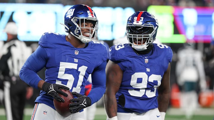 Jan 7, 2024; East Rutherford, New Jersey, USA; New York Giants linebacker Azeez Ojulari (51) celebrates with defensive tackle Rakeem Nunez-Roches (93) after recovering a fumble during the second half against the Philadelphia Eagles at MetLife Stadium. Mandatory Credit: Vincent Carchietta-Imagn Images