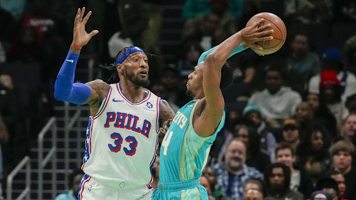 Dec 16, 2023; Charlotte, North Carolina, USA; Charlotte Hornets guard Ish Smith (14) attempts to pass the ball against Philadelphia 76ers forward Robert Covington (33) during the second quarter at Spectrum Center. Mandatory Credit: Jim Dedmon-Imagn Images Dec 16, 2023; Charlotte, North Carolina, USA; Charlotte Hornets guard Ish Smith (14) attempts to pass the ball against Philadelphia 76ers forward Robert Covington (33) during the second quarter at Spectrum Center. Mandatory Credit: Jim Dedmon-Imagn Images