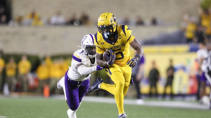 Sep 7, 2024; Morgantown, West Virginia, USA; West Virginia Mountaineers wide receiver Jaden Bray (5) catches a pass and runs for extra yards during the third quarter against the Albany Great Danes at Mountaineer Field at Milan Puskar Stadium. Mandatory Credit: Ben Queen-Imagn Images Sep 7, 2024; Morgantown, West Virginia, USA; West Virginia Mountaineers wide receiver Jaden Bray (5) catches a pass and runs for extra yards during the third quarter against the Albany Great Danes at Mountaineer Field at Milan Puskar Stadium. Mandatory Credit: Ben Queen-Imagn Images
