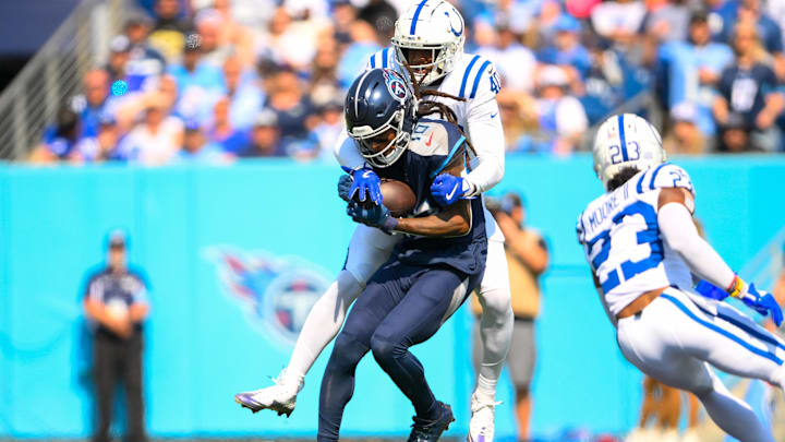 Oct 13, 2024; Nashville, Tennessee, USA; Indianapolis Colts cornerback Jaylon Jones (40) tackles Tennessee Titans wide receiver DeAndre Hopkins (10) after a made catch during the first half at Nissan Stadium. Mandatory Credit: Steve Roberts-Imagn Images Oct 13, 2024; Nashville, Tennessee, USA; Indianapolis Colts cornerback Jaylon Jones (40) tackles Tennessee Titans wide receiver DeAndre Hopkins (10) after a made catch during the first half at Nissan Stadium. Mandatory Credit: Steve Roberts-Imagn Images