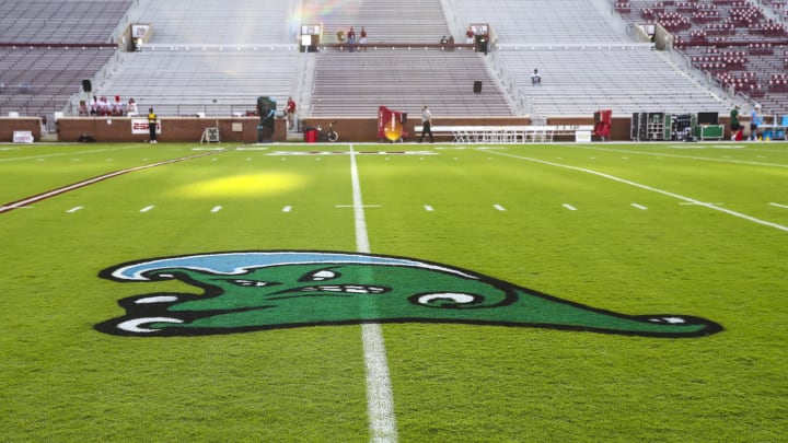 Sep 4, 2021; Norman, Oklahoma, USA; The logo of the Tulane Green Wave is displayed on the field before the game against the Oklahoma Sooners at Gaylord Family-Oklahoma Memorial Stadium. Sep 4, 2021; Norman, Oklahoma, USA; The logo of the Tulane Green Wave is displayed on the field before the game against the Oklahoma Sooners at Gaylord Family-Oklahoma Memorial Stadium.