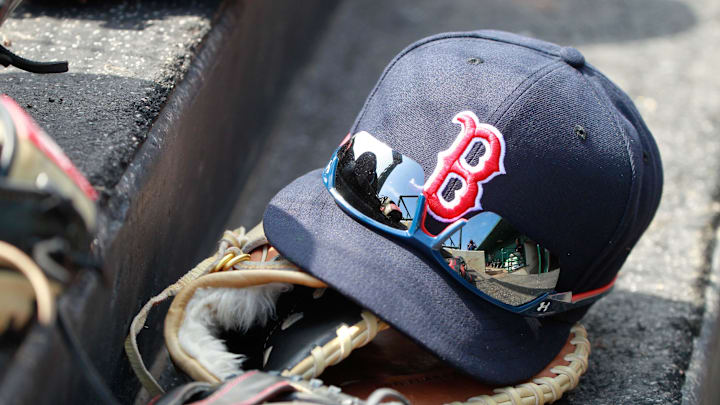 Mar 7, 2015; Sarasota, FL, USA; A general view of Boston Red Sox hat and glove laying in the dugout at a spring training baseball game at Ed Smith Stadium. Mandatory Credit: Kim Klement-Imagn Images Mar 7, 2015; Sarasota, FL, USA; A general view of Boston Red Sox hat and glove laying in the dugout at a spring training baseball game at Ed Smith Stadium. Mandatory Credit: Kim Klement-Imagn Images