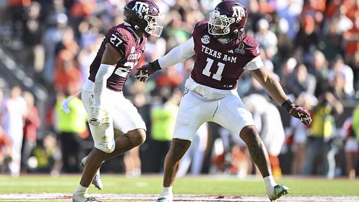 Dec 20, 2025; College Station, TX, USA; Texas A&M Aggies linebacker Daymion Sanford (27) reacts with defensive tackle Tyler Onyedim (11) after recovering a fumble against the Miami Hurricanes during the second half of the first round game of the CFP National Playoff at Kyle Field. Mandatory Credit: Maria Lysaker-Imagn Images Dec 20, 2025; College Station, TX, USA; Texas A&M Aggies linebacker Daymion Sanford (27) reacts with defensive tackle Tyler Onyedim (11) after recovering a fumble against the Miami Hurricanes during the second half of the first round game of the CFP National Playoff at Kyle Field. Mandatory Credit: Maria Lysaker-Imagn Images
