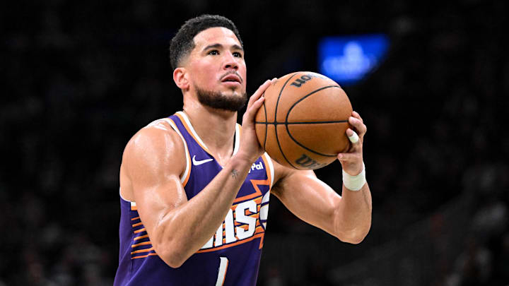Mar 16, 2026; Boston, Massachusetts, USA; Phoenix Suns guard Devin Booker (1) attempts a free throw against the Boston Celtics during the first half at the TD Garden. Mandatory Credit: Brian Fluharty-Imagn Images