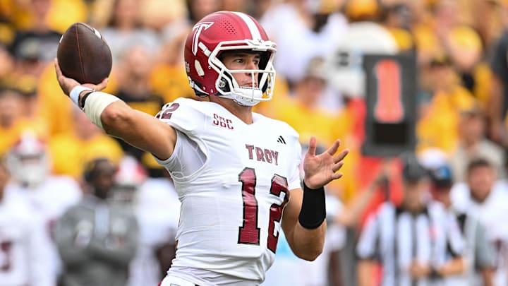 Sep 14, 2024; Iowa City, Iowa, USA; Troy Trojans quarterback Matthew Caldwell (12) throws a pass during the first quarter against the Iowa Hawkeyes at Kinnick Stadium. Mandatory Credit: Jeffrey Becker-Imagn Images