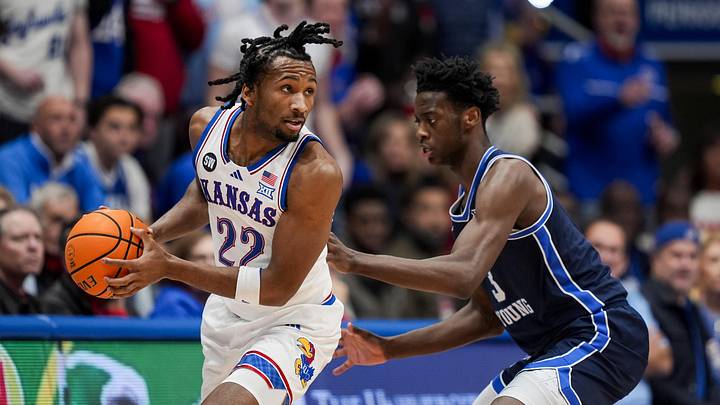 Jan 24, 2026; Columbia, Missouri, USA; Kansas Jayhawks guard Darryn Peterson (22) looks to pass against BYU Cougars forward AJ Dybantsa (3) during the first half at Mizzou Arena. Mandatory Credit: Jay Biggerstaff-Imagn Images