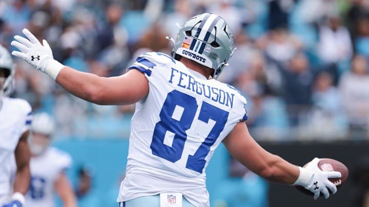 Dallas Cowboys tight end Jake Ferguson celebrates a touchdown against the Carolina Panthers at Bank of America Stadium. Dallas Cowboys tight end Jake Ferguson celebrates a touchdown against the Carolina Panthers at Bank of America Stadium.