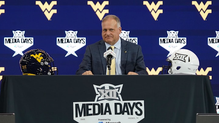 Jul 9, 2025; Frisco, TX, USA; West Virginia head coach Rich Rodriguez speaks with the media during 2025 Big 12 Football Media Days at The Star. Mandatory Credit: Raymond Carlin III-Imagn Images Jul 9, 2025; Frisco, TX, USA; West Virginia head coach Rich Rodriguez speaks with the media during 2025 Big 12 Football Media Days at The Star. Mandatory Credit: Raymond Carlin III-Imagn Images