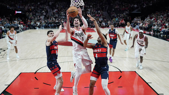 Mar 17, 2025; Portland, Oregon, USA: Portland Trail Blazers small forward Deni Avdija (8) shoots against Washington Wizards guard Jaylen Martin (4) and power forward Tristan Vukcevic (00) during the first half at Moda Center. Mandatory Credit: Soobum Im-Imagn Images Mar 17, 2025; Portland, Oregon, USA: Portland Trail Blazers small forward Deni Avdija (8) shoots against Washington Wizards guard Jaylen Martin (4) and power forward Tristan Vukcevic (00) during the first half at Moda Center. Mandatory Credit: Soobum Im-Imagn Images