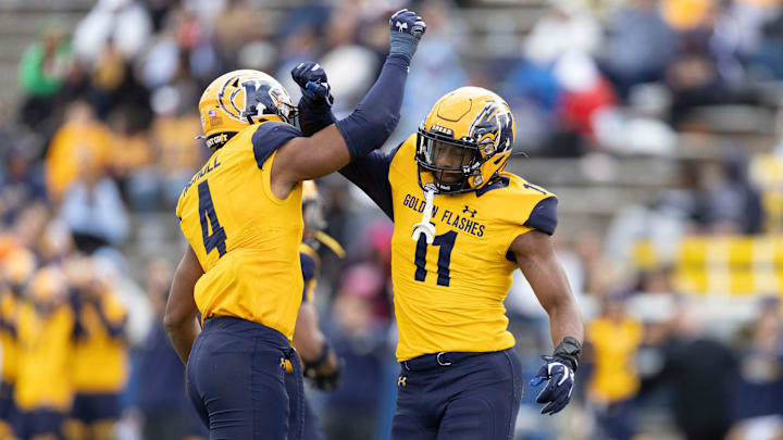 Kent State defensive end Kameron Olds (right) and linebacker Rocco Nicholl celebrate after Olds makes his second sack against Saint Francis (Pa.), Sept. 7, 2024.