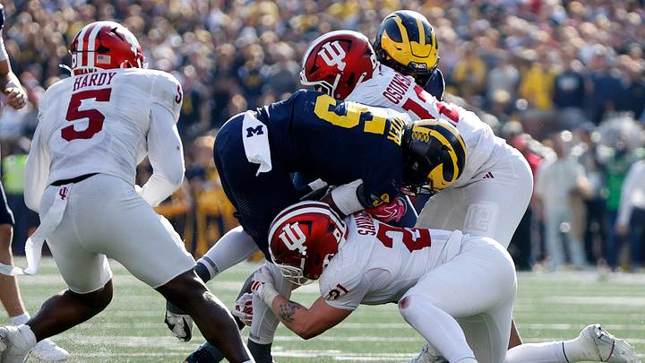 Oct 24, 2026; Ann Arbor, Michigan, USA;  Indiana Hoosiers linebacker Jacob Savage (21) takes down 
Michigan Wolverines running back Savion Hiter (5) during the second half at Michigan Stadium.  Mandatory Credit: Brian Bradshaw Sevald-Imagn Images