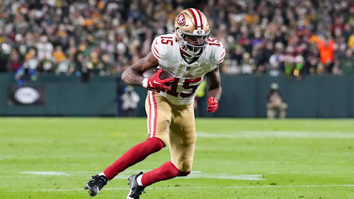 Nov 24, 2024; Green Bay, Wisconsin, USA;  San Francisco 49ers wide receiver Jauan Jennings (15) rushes with the football after catching a pass during the second quarter against the Green Bay Packers at Lambeau Field. Mandatory Credit: Jeff Hanisch-Imagn Images