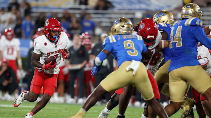 Sep 12, 2025; Pasadena, California, USA;  New Mexico Lobos running back Damon Bankston (1) runs with the ball during the fourth quarter against the UCLA Bruins at Rose Bowl. Mandatory Credit: Kiyoshi Mio-Imagn Images