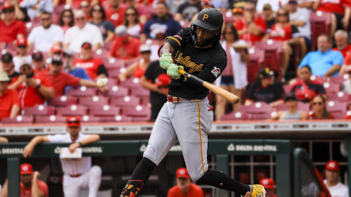Pittsburgh Pirates outfielder Oneil Cruz (15) hits a solo home run in the first inning against the Cincinnati Reds at Great American Ball Park. 