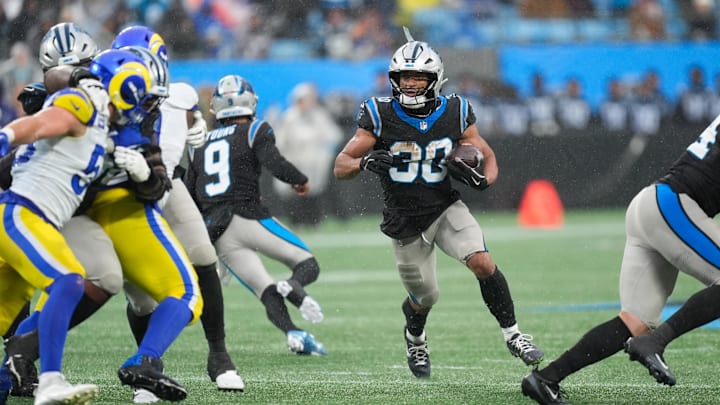 Nov 30, 2025; Charlotte, North Carolina, USA; Carolina Panthers running back Chuba Hubbard (30) rushes during the fourth quarter against the Los Angeles Rams at Bank of America Stadium. Mandatory Credit: Jim Dedmon-Imagn Images