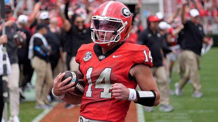 Georgia quarterback Gunner Stockton (14) runs in for another touchdown during the first half of a NCAA college football game against Kentucky in Athens, Ga., on Saturday, October 4, 2025.