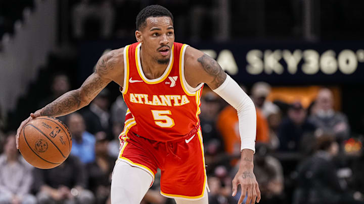 Mar 10, 2024; Atlanta, Georgia, USA; Atlanta Hawks guard Dejounte Murray (5) controls the ball against the New Orleans Pelicans during the first half at State Farm Arena.