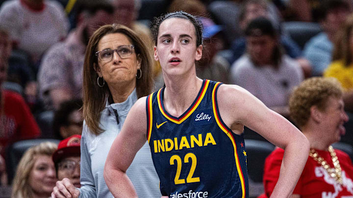 Jun 17, 2025; Indianapolis, Indiana, USA; Indiana Fever guard Caitlin Clark (22)  and head coach Stephanie White in the first half against the Connecticut Sun at Gainbridge Fieldhouse. Mandatory Credit: Trevor Ruszkowski-Imagn Images