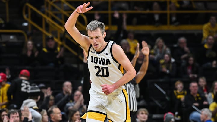Dec 30, 2024; Iowa City, Iowa, USA; Iowa Hawkeyes forward Payton Sandfort (20) reacts during the first half against the New Hampshire Wildcats at Carver-Hawkeye Arena. Mandatory Credit: Jeffrey Becker-Imagn Images Dec 30, 2024; Iowa City, Iowa, USA; Iowa Hawkeyes forward Payton Sandfort (20) reacts during the first half against the New Hampshire Wildcats at Carver-Hawkeye Arena. Mandatory Credit: Jeffrey Becker-Imagn Images