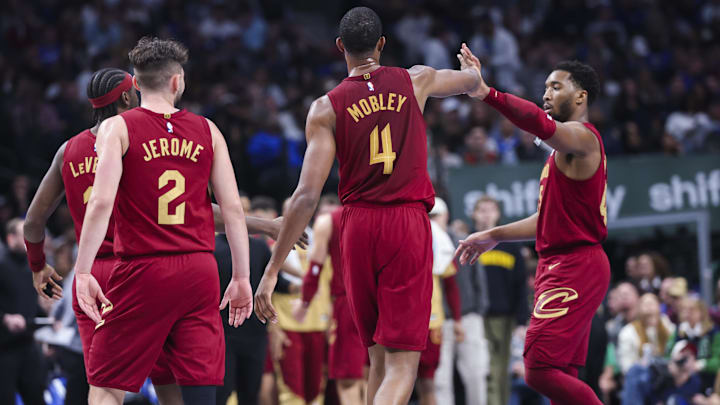 Jan 3, 2025; Dallas, Texas, USA;  Cleveland Cavaliers forward Evan Mobley (4) celebrates with Cleveland Cavaliers guard Donovan Mitchell (45) during the first half against the Dallas Mavericks at American Airlines Center. Mandatory Credit: Kevin Jairaj-Imagn Images