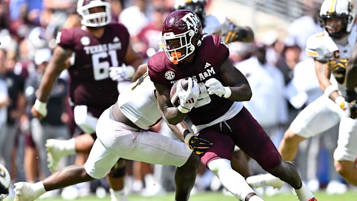 Oct 5, 2024; College Station, Texas, USA; Texas A&M Aggies running back Le'Veon Moss (8) carries the ball in the second half against the Missouri Tigers at Kyle Field. Mandatory Credit: Maria Lysaker-Imagn Images. 