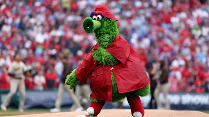 The Philly Phanatic performs in a raincoat before game five of the NLCS between the Philadelphia Phillies and the San Diego Padres