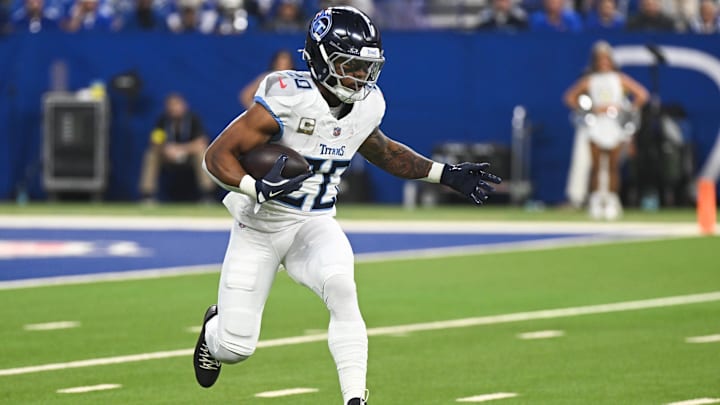 Oct 26, 2025; Indianapolis, Indiana, USA;  Tennessee Titans running back Tony Pollard (20) rushes during the first quarter against the Indianapolis Colts at Lucas Oil Stadium. Mandatory Credit: Robert Goddin-Imagn Images