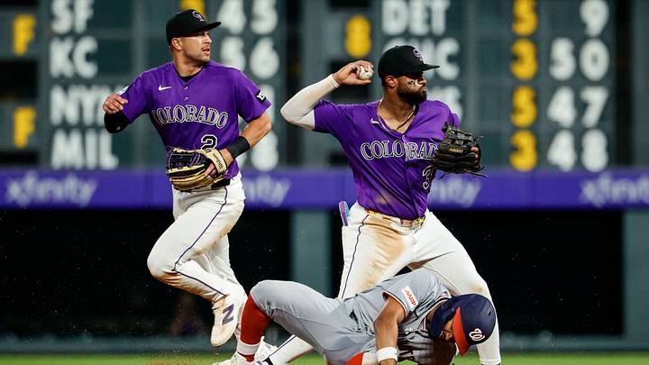 Washington Nationals second baseman Nasim Nunez (26) slides out into second against Colorado Rockies second baseman Willi Castro (3) as right fielder Tyler Freeman (2) looks on.  Credit: Isaiah J. Downing-Imagn Images