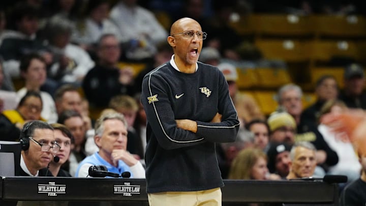 Feb 15, 2025; Boulder, Colorado, USA; UCF Knights head coach Johnny Dawkins calls out in the first half against the Colorado Buffaloes at the CU Events Center. Mandatory Credit: Ron Chenoy-Imagn Images