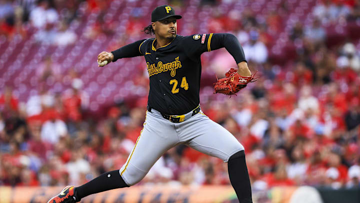 Sep 23, 2025; Cincinnati, Ohio, USA; Pittsburgh Pirates starting pitcher Johan Oviedo (24) pitches against the Cincinnati Reds in the first inning at Great American Ball Park. Mandatory Credit: Katie Stratman-Imagn Images