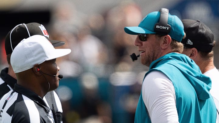 Carolina Panthers head coach Liam Coen talks to the referee and a line judge during the third quarter of an NFL football game between the Carolina Panthers at Jacksonville Jaguars at EverBank Stadium Sunday September 7, 2025. [Doug Engle/Florida Times-Union]