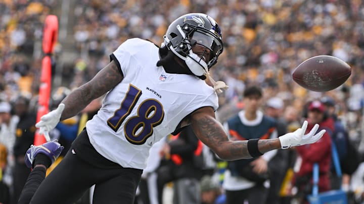 Nov 17, 2024; Pittsburgh, Pennsylvania, USA; Baltimore Ravens wide receiver Diontae Johnson (18) reaches for an incomplete pass against the Pittsburgh Steelers during the first quarter at Acrisure Stadium.