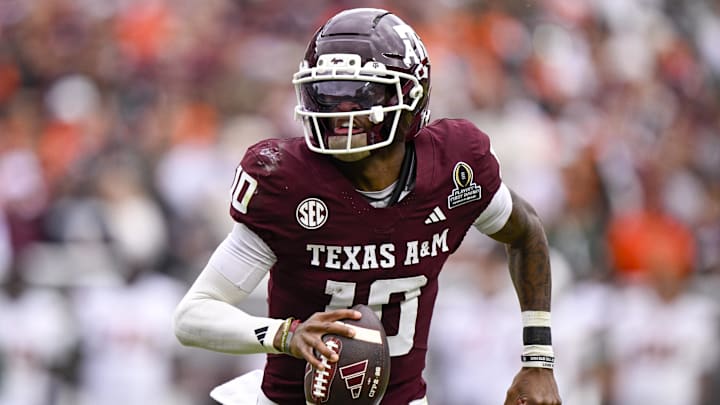 Texas A&M Aggies quarterback Marcel Reed runs with the ball during the game between the Aggies and the Hurricanes at Kyle Field. 