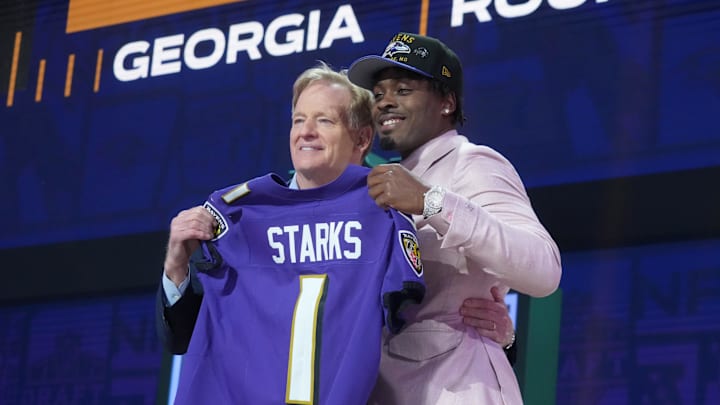 Apr 24, 2025; Green Bay, WI, USA; NFL commissioner Roger Goodell with Georgia Bulldogs safety Malaki Starks after he is selected by the Baltimore Ravens as the number 27 pick in the first round of the 2025 NFL Draft at Lambeau Field. Mandatory Credit: Kirby Lee-Imagn Images