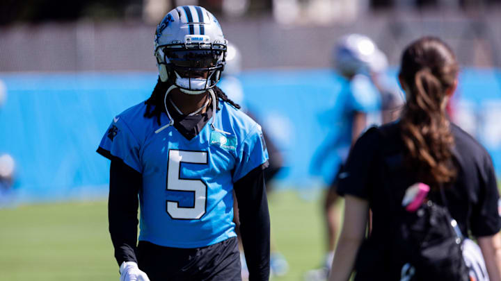 Jul 23, 2025; Charlotte, NC, USA; Carolina Panthers running back Rico Dowdle (5) walks back during training camp. Mandatory Credit: Scott Kinser-Imagn Images