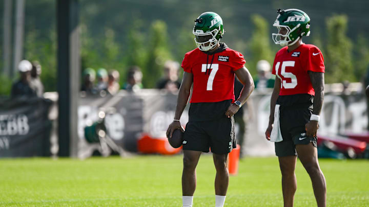Jul 25, 2025; Florham Park, NJ, USA; New York Jets quarterbacks Justin Fields (7) and Adrian Martinez (15) look on during a drill at training camp at Atlantic Health Jets Training Center. Mandatory Credit: John Jones-Imagn Images