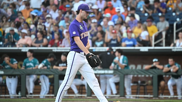 Jun 21, 2025; Omaha, Neb, USA; LSU Tigers starting pitcher Kade Anderson (32) walks to the dugout after the eighth inning against the Coastal Carolina Chanticleers at Charles Schwab Field. Mandatory Credit: Steven Branscombe-Imagn Images Jun 21, 2025; Omaha, Neb, USA; LSU Tigers starting pitcher Kade Anderson (32) walks to the dugout after the eighth inning against the Coastal Carolina Chanticleers at Charles Schwab Field. Mandatory Credit: Steven Branscombe-Imagn Images
