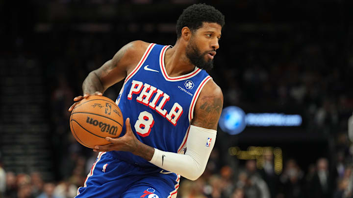 Nov 4, 2024; Phoenix, Arizona, USA; Philadelphia 76ers forward Paul George (8) protects the ball against the Phoenix Suns during the first half at Footprint Center. Mandatory Credit: Joe Camporeale-Imagn Images