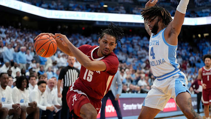 Dec 4, 2024; Chapel Hill, North Carolina, USA; Alabama Crimson Tide forward Jarin Stevenson (15) with the ball as North Carolina Tar Heels guard RJ Davis (4) defends in the first half at Dean E. Smith Center. Mandatory Credit: Bob Donnan-Imagn Images Dec 4, 2024; Chapel Hill, North Carolina, USA; Alabama Crimson Tide forward Jarin Stevenson (15) with the ball as North Carolina Tar Heels guard RJ Davis (4) defends in the first half at Dean E. Smith Center. Mandatory Credit: Bob Donnan-Imagn Images